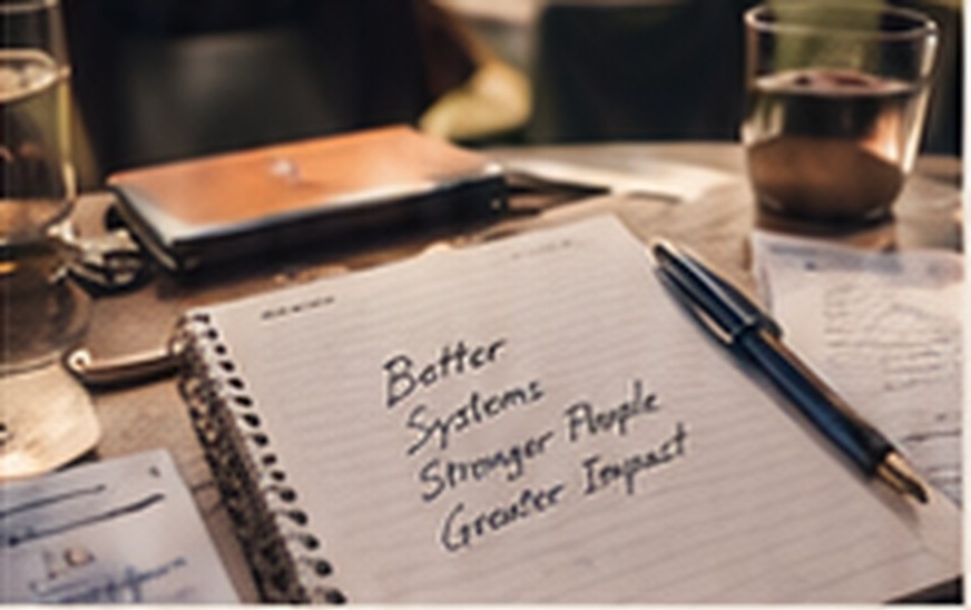Notebook close-up with strategy notes and pen